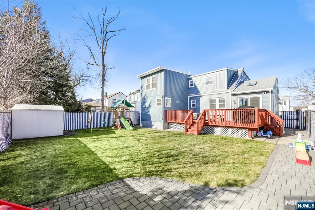 23-26 Berkshire Road Fair Lawn, NJ 07410 - Photo 35 of 36 a view of a house with a yard and furniture