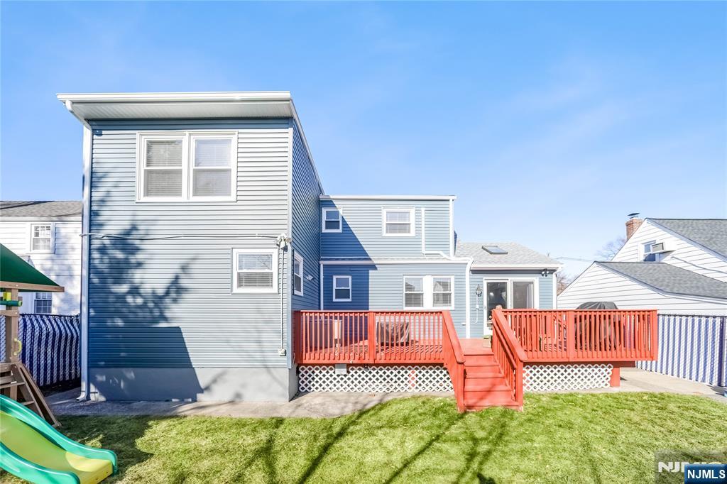 23-26 Berkshire Road Fair Lawn, NJ 07410 - Photo 36 of 36 a front view of a house with a yard