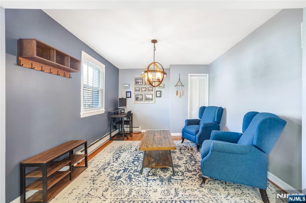 23-26 Berkshire Road Fair Lawn, NJ 07410 - Photo 10 of 36 a living room with furniture a rug and a window