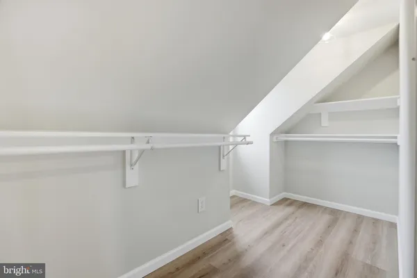 a view of a room with racks on the wall