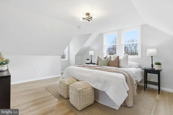 a bedroom with bed and window