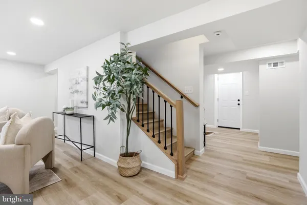 a view of entryway with wooden floor