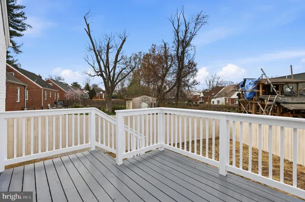 a view of deck with wooden floor and fence