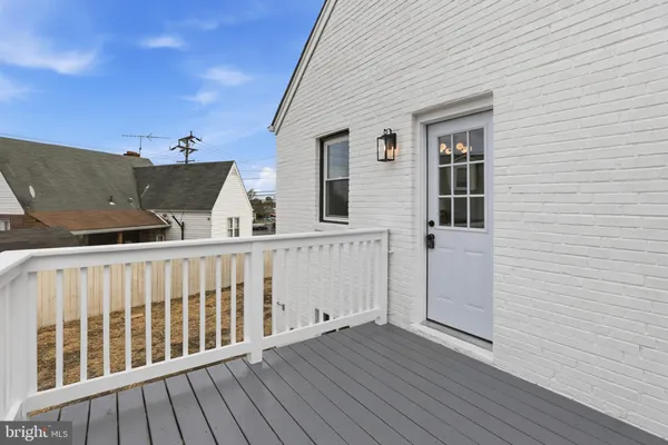 a view of balcony with furniture