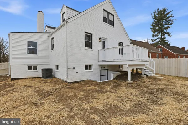 a view of a house with a house and yard