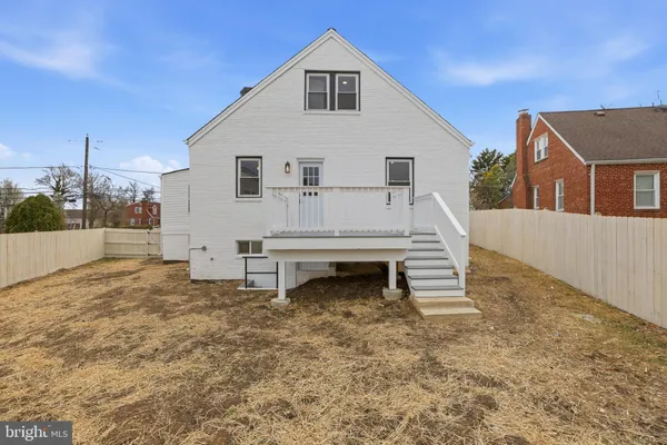 a view of a pathway with a wrought fence