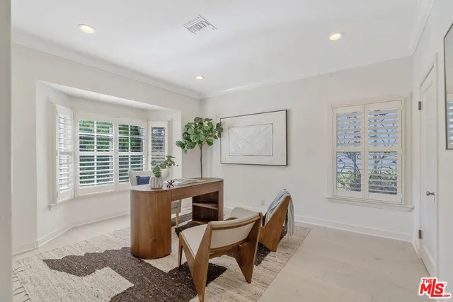 a workspace with furniture and a window