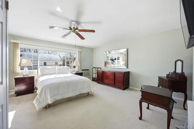 a bedroom with bed and a couch