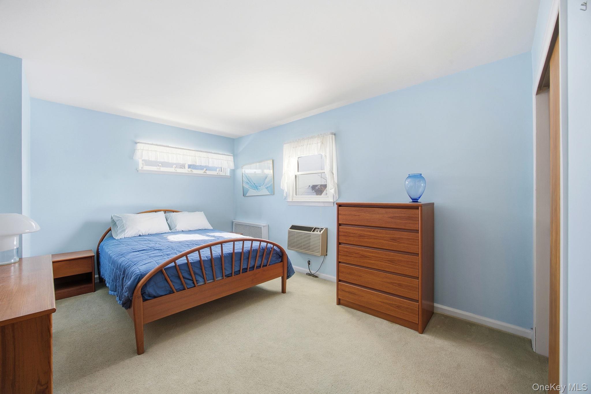54 Aberdeen Road New Hyde Park, NY 11040 - Photo 16 of 26 a room with a bed and a dresser