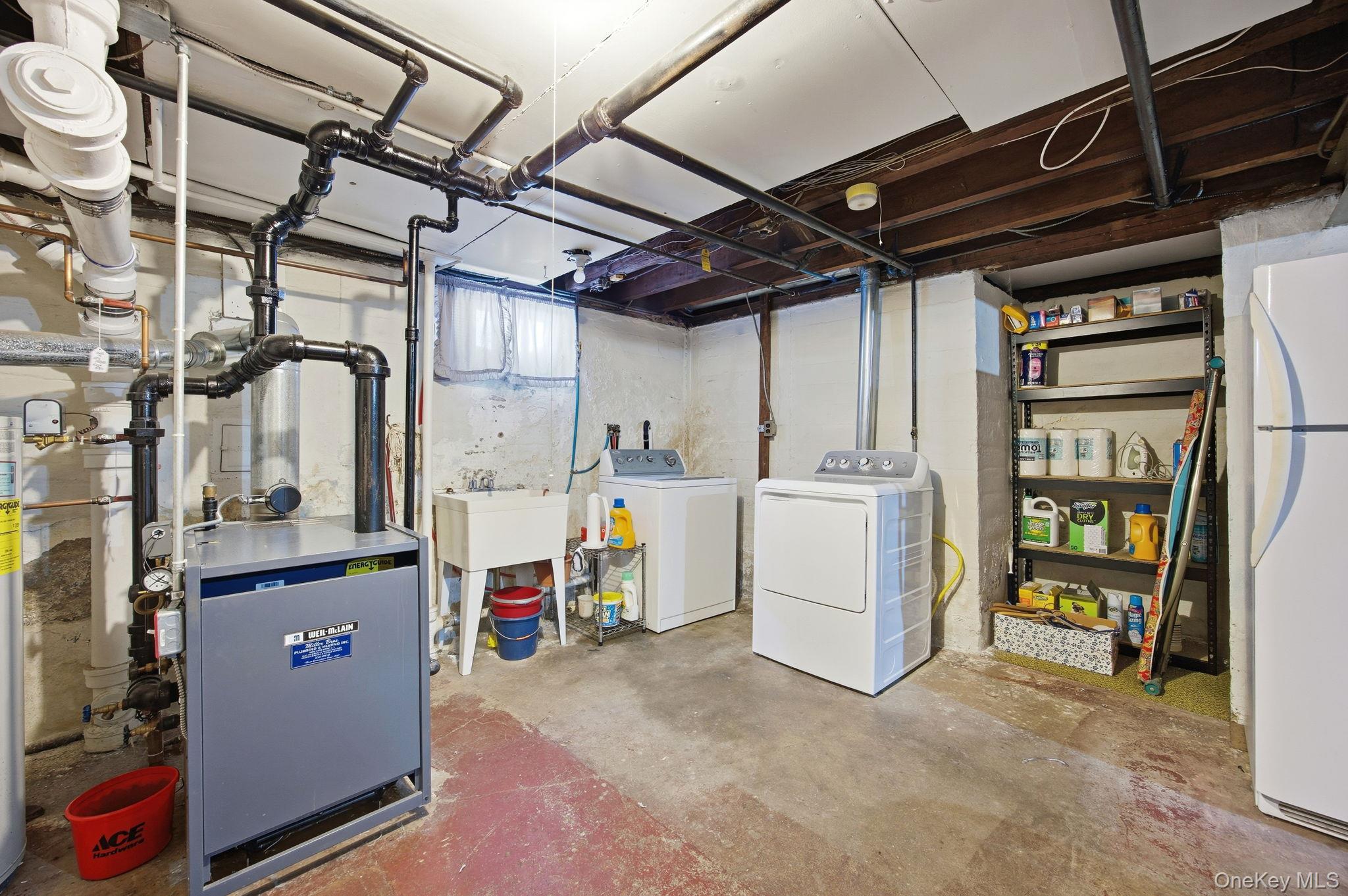 54 Aberdeen Road New Hyde Park, NY 11040 - Photo 20 of 26 a utility room with dryer and washer