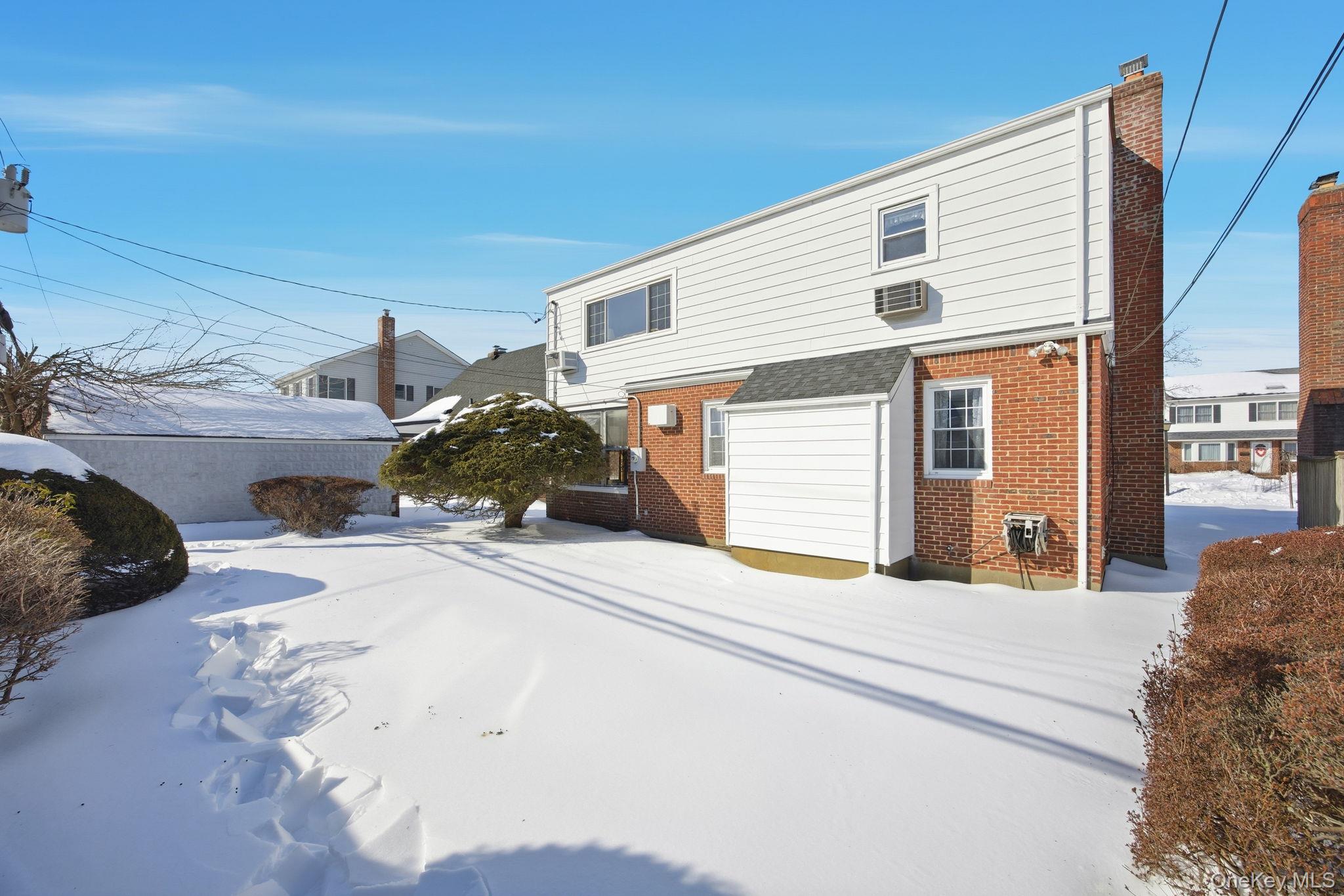 54 Aberdeen Road New Hyde Park, NY 11040 - Photo 22 of 26 a view of a house with a patio