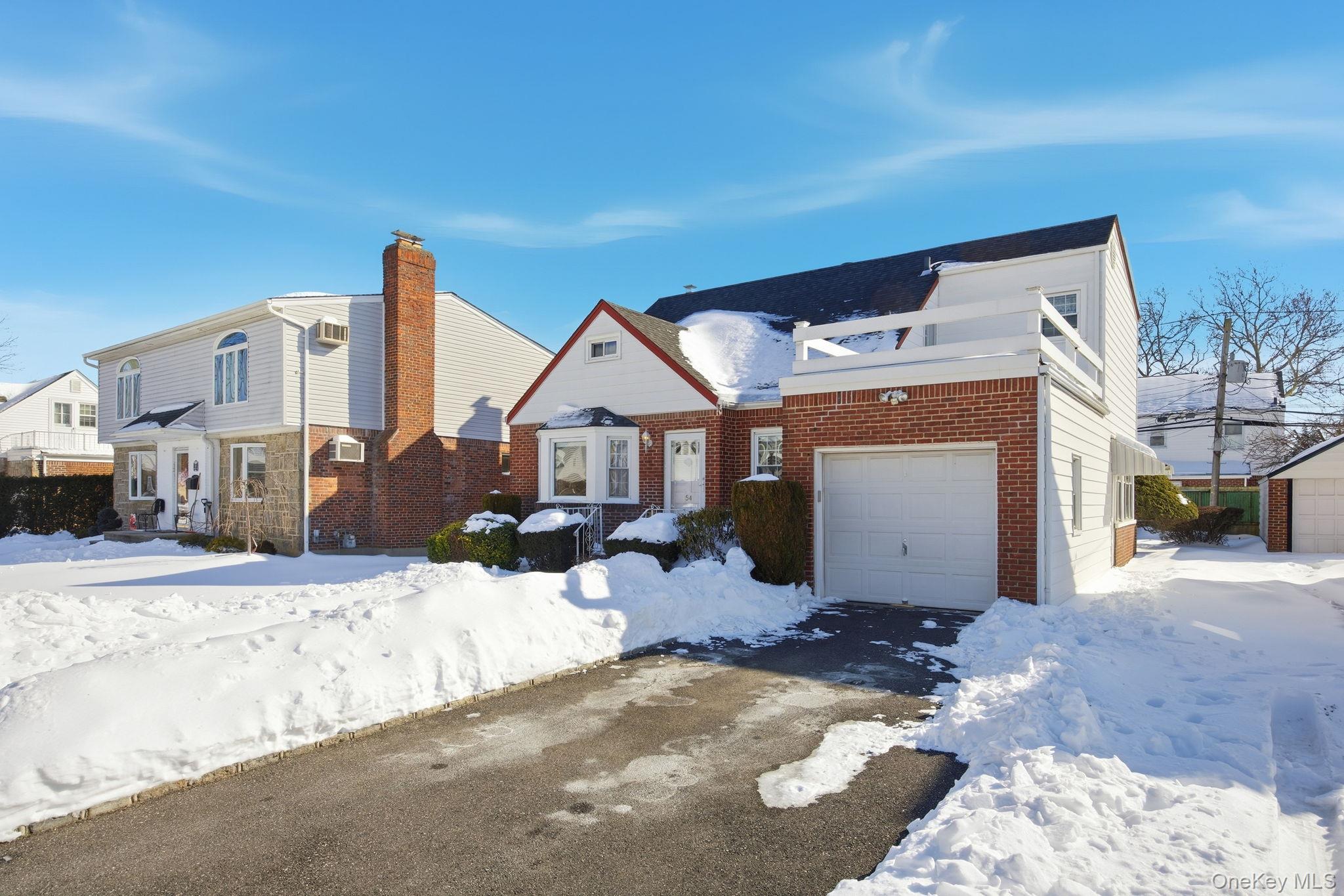 54 Aberdeen Road New Hyde Park, NY 11040 - Photo 3 of 26 a front view of a house with a yard