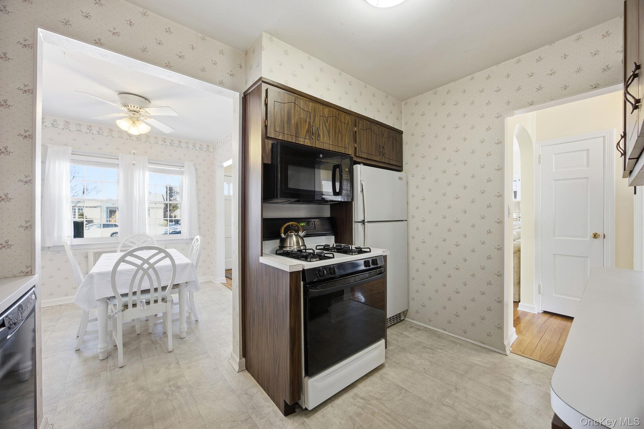 54 Aberdeen Road New Hyde Park, NY 11040 - Photo 9 of 26 a kitchen with granite countertop a stove and a sink