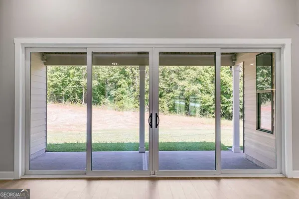 a view of a room that has a large window