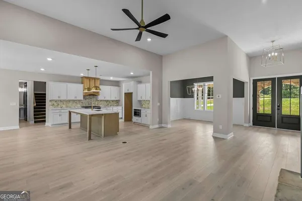 a view of kitchen with cabinets and wooden floor