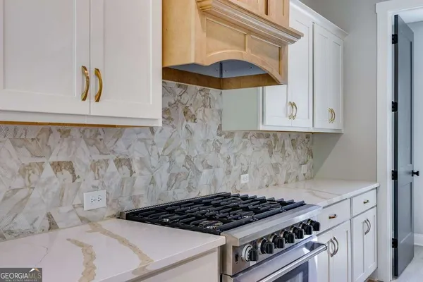 a kitchen with a stove and a cabinet