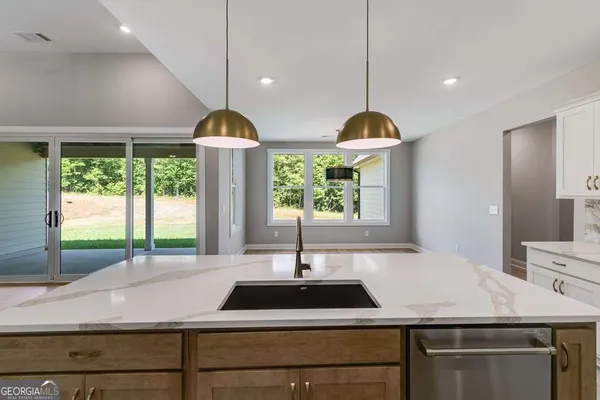 a kitchen with sink and window