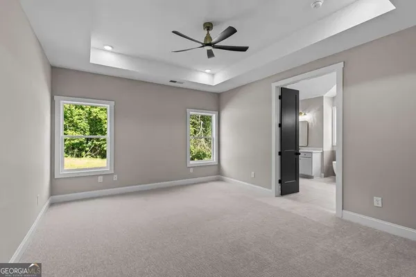 an empty room that has a window in it