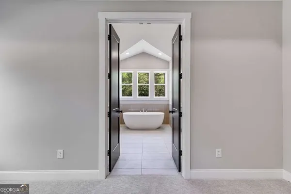 a view of front door and bedroom