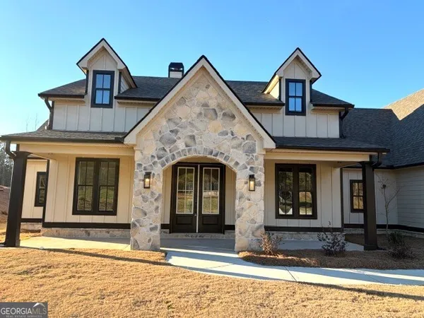 a front view of a house with a porch