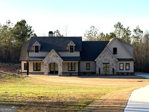 a front view of a house with a ocean view