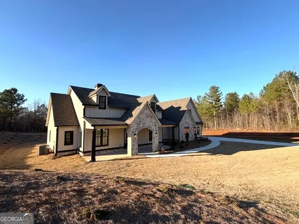 a house with trees in the background
