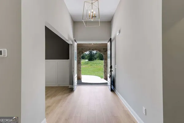 a view of a porch with wooden floor a fireplace