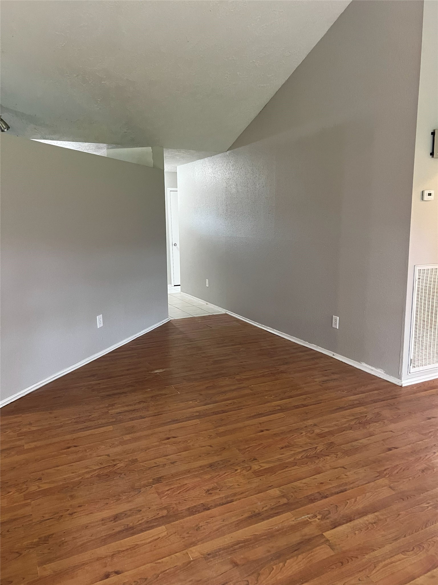 6507 Bridgegate Drive Spring, TX 77373 - Photo 15 of 17 a view of an empty room with wooden floor