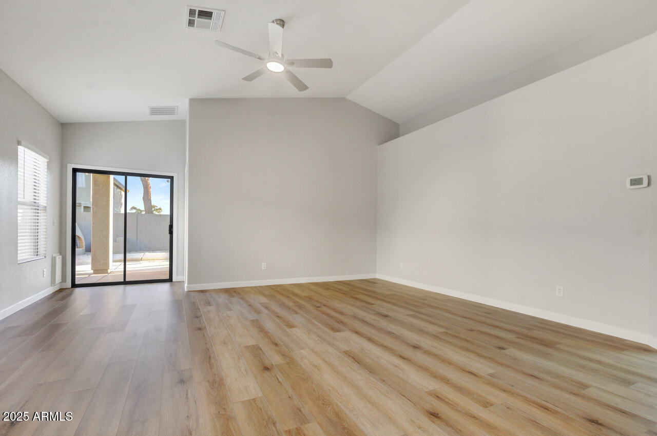 13431 West Evans Drive Surprise, AZ 85379 - Photo 12 of 37 wooden floor in an empty room with a window