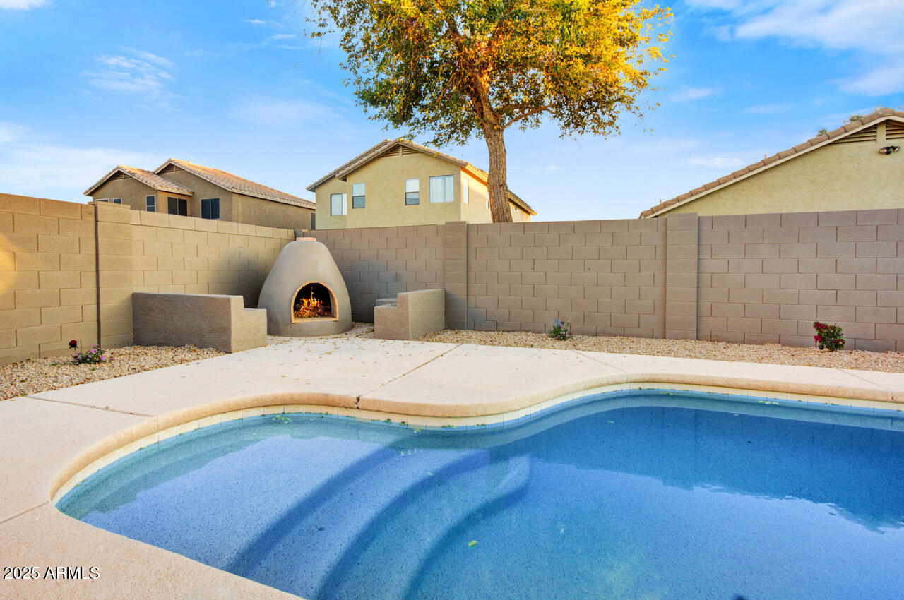 13431 West Evans Drive Surprise, AZ 85379 - Photo 28 of 37 a swimming pool with a outdoor seating area