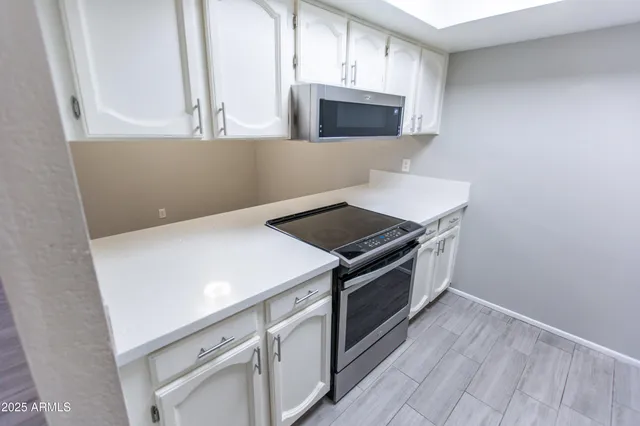 a kitchen with a stove and a microwave