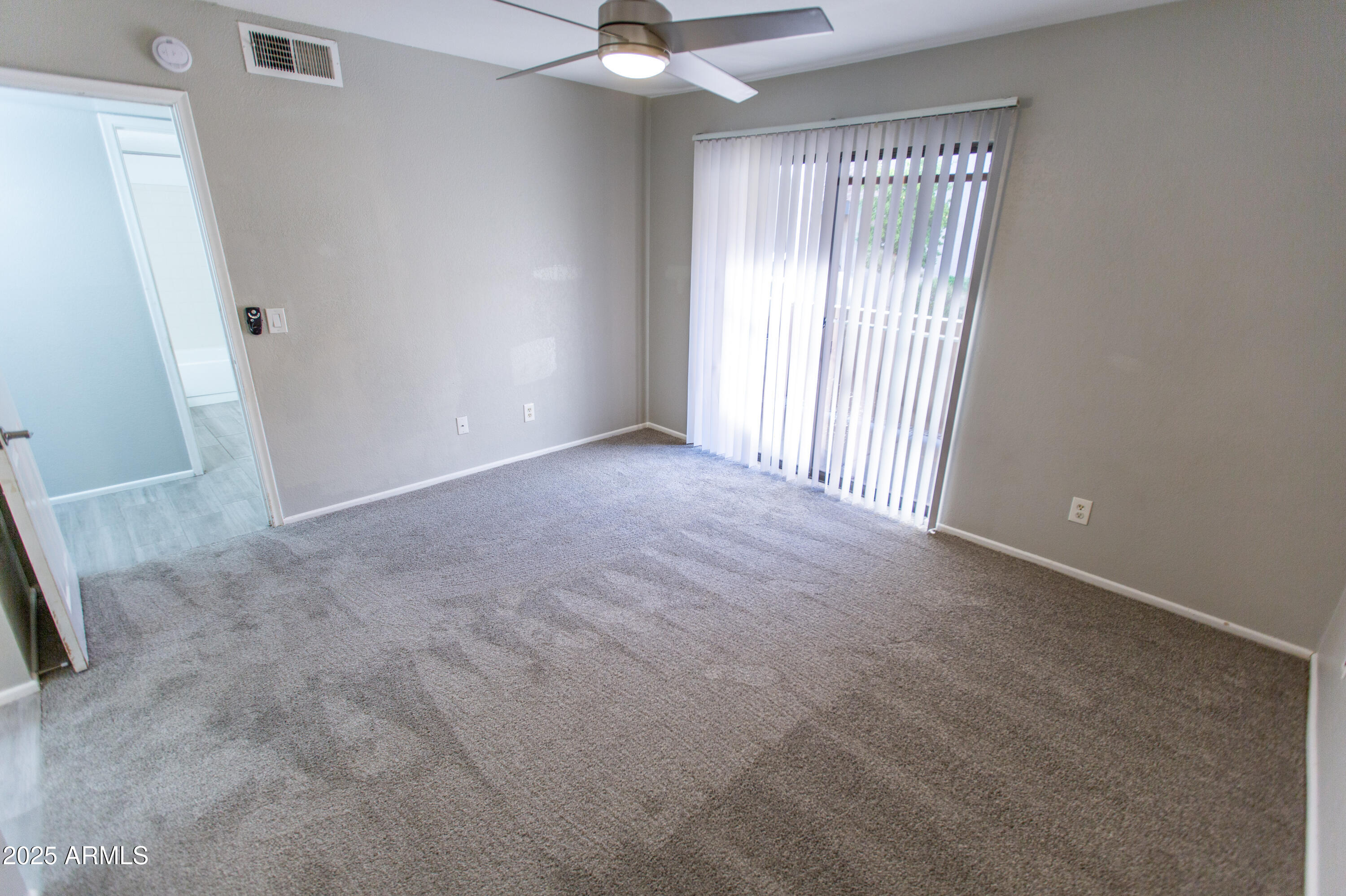 1402 East Guadalupe Road, Unit 153 Tempe, AZ 85283 - Photo 21 of 25 an empty room with a window