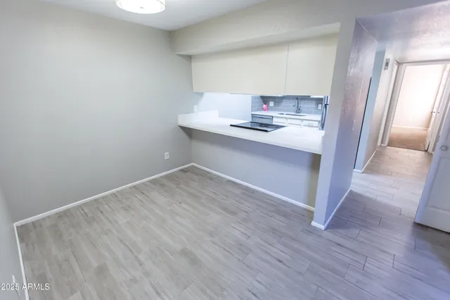 a room with wooden floor and shoes