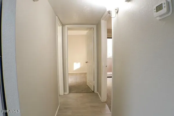 a view of a bathroom from the hallway