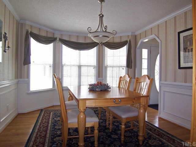 283 Mark Lane Raleigh, NC 27603 - Photo 2 of 12 Dining Room with hardwood floors and bay window Other