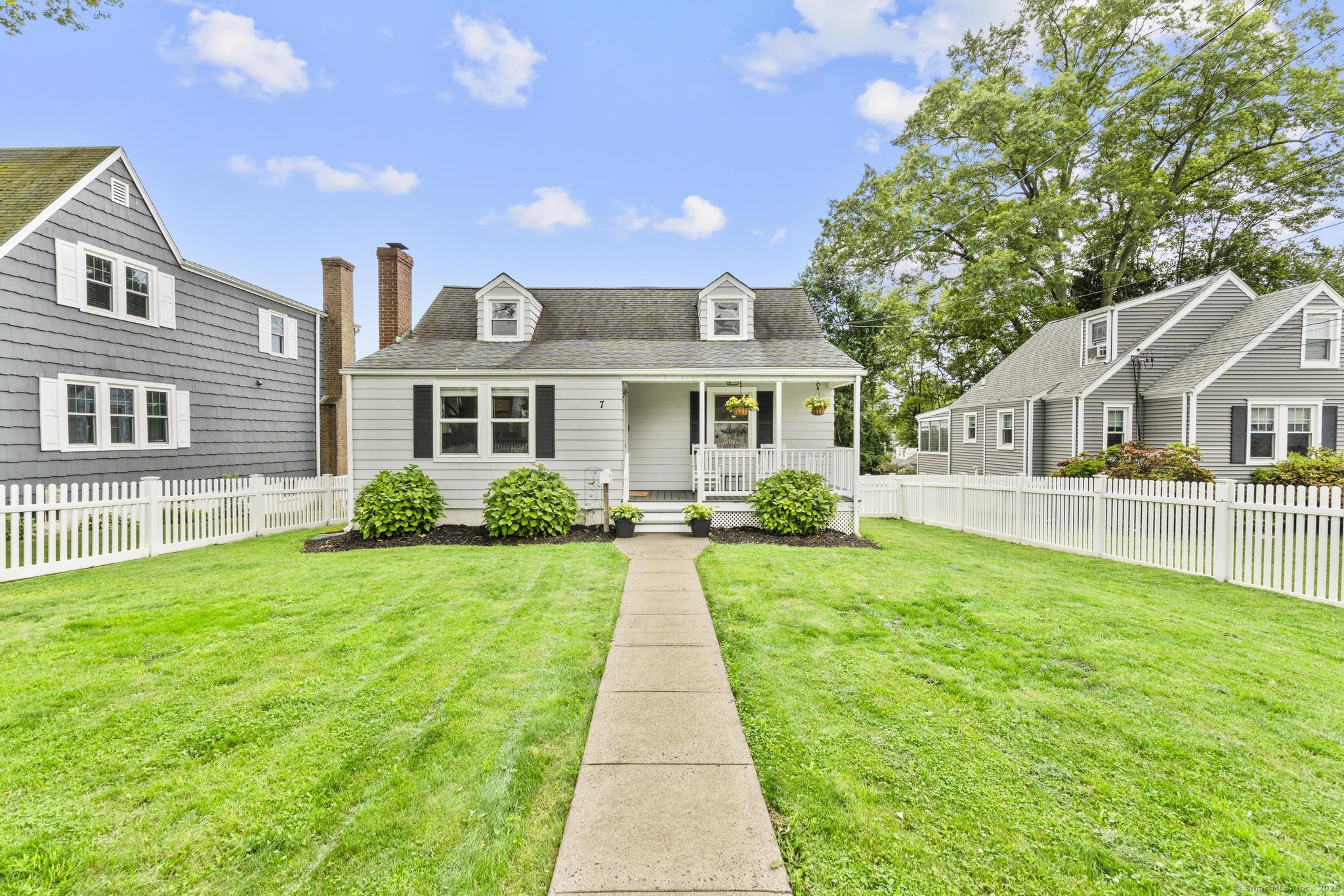a front view of a house with yard