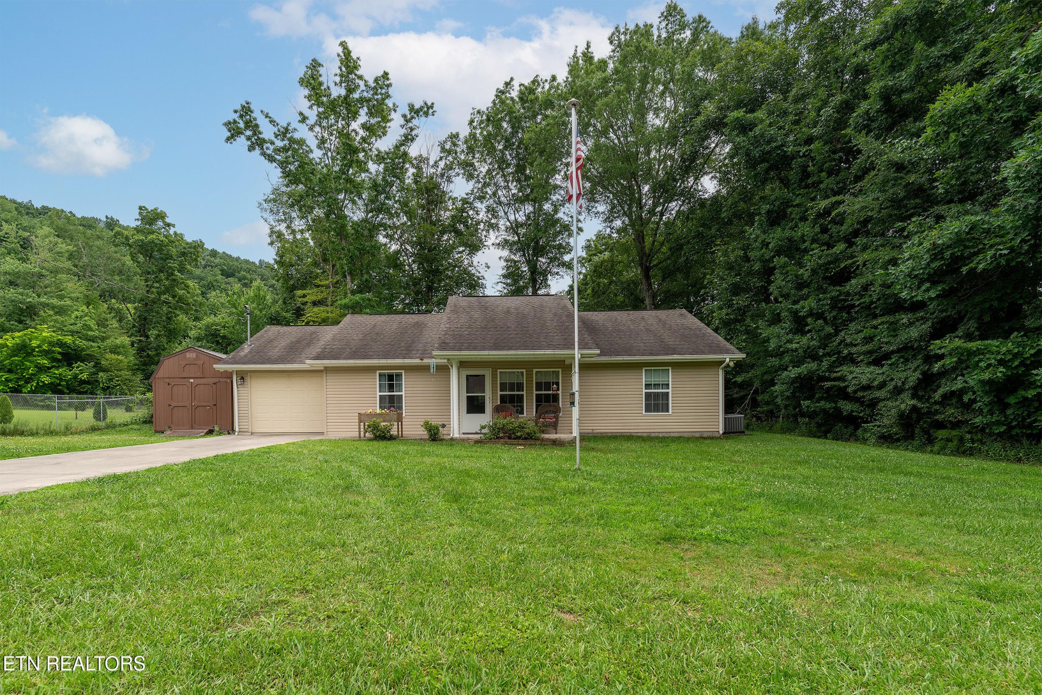 534 Shellbark Road Newport, TN 37821 - Photo 2 of 29 a house with a tree in front of it