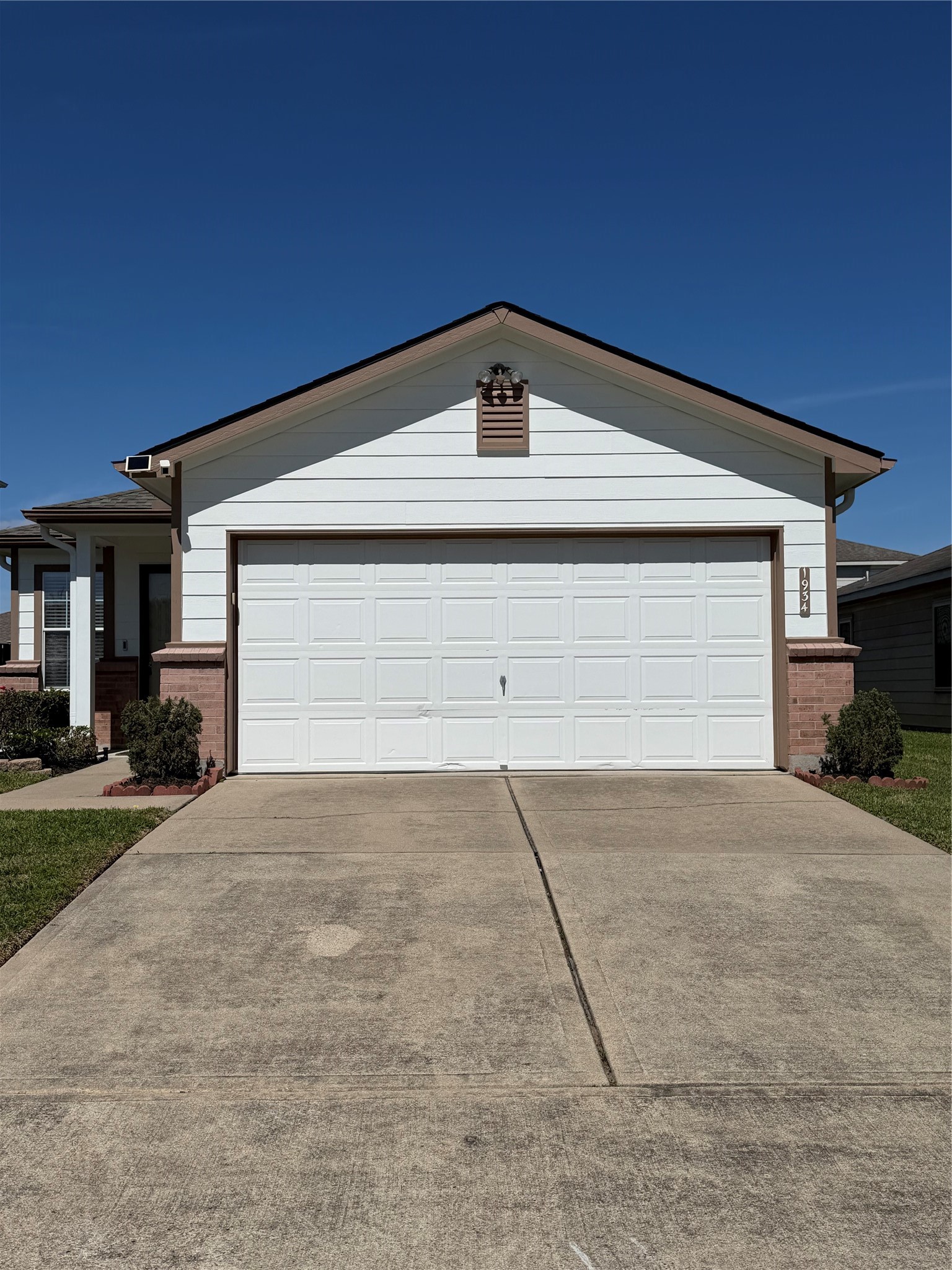 a view of garage and yard