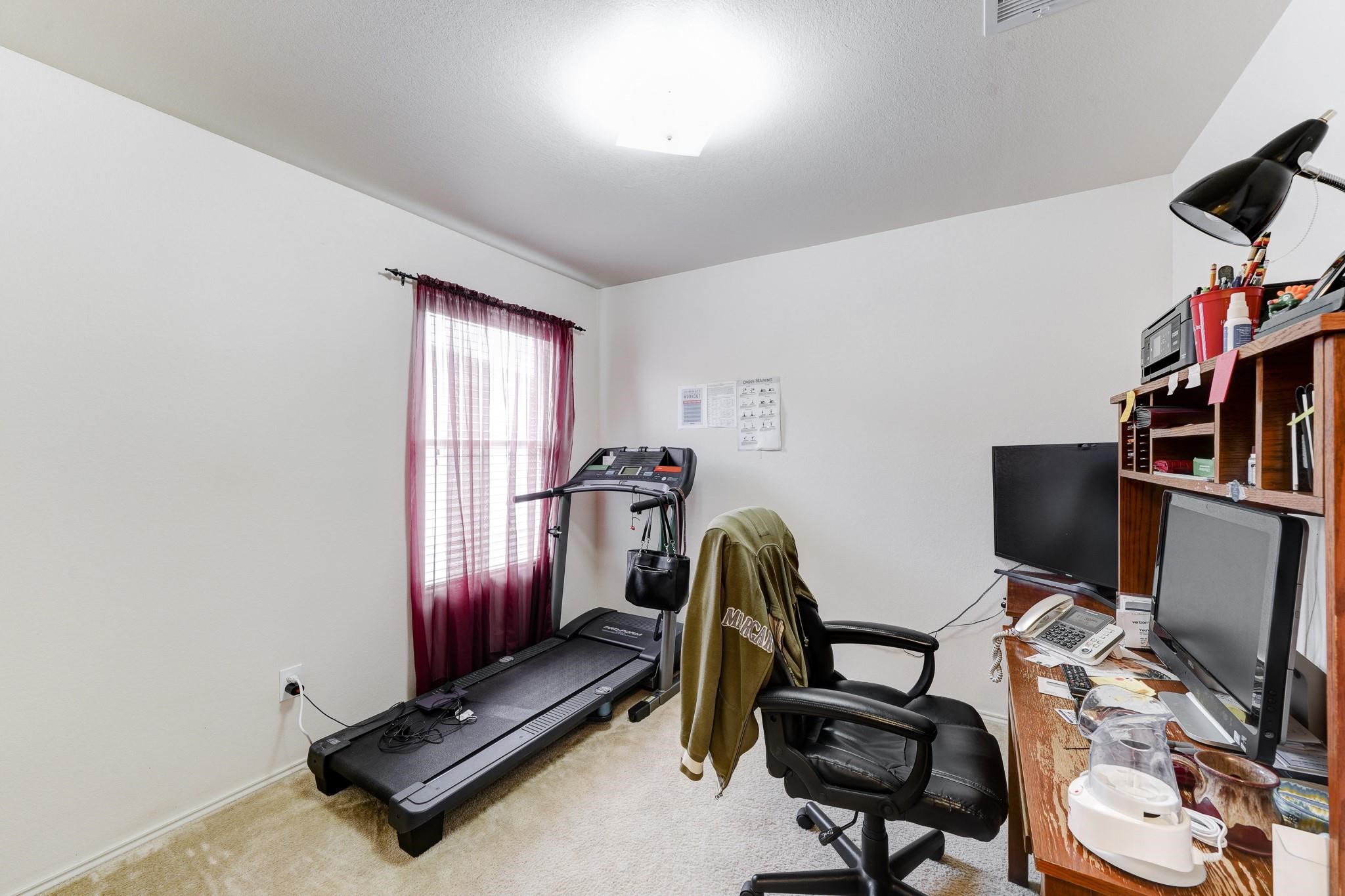 1934 Robcrest Way Missouri City, TX 77489 - Photo 16 of 24 a view of a room with gym equipment