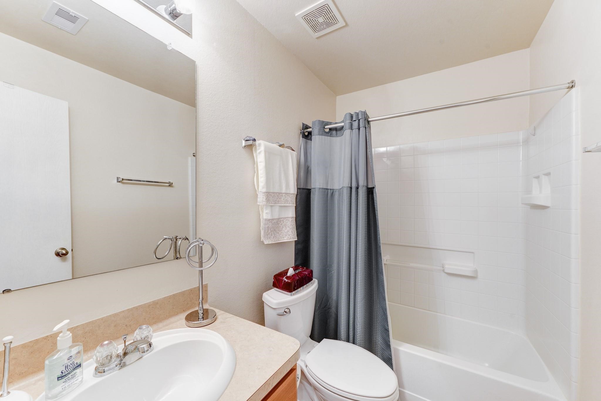 1934 Robcrest Way Missouri City, TX 77489 - Photo 17 of 24 a bathroom with a sink toilet and shower