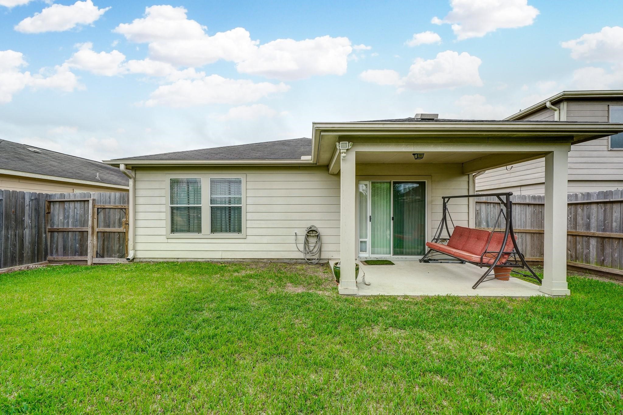 1934 Robcrest Way Missouri City, TX 77489 - Photo 18 of 24 a view of a house with a backyard and sitting area
