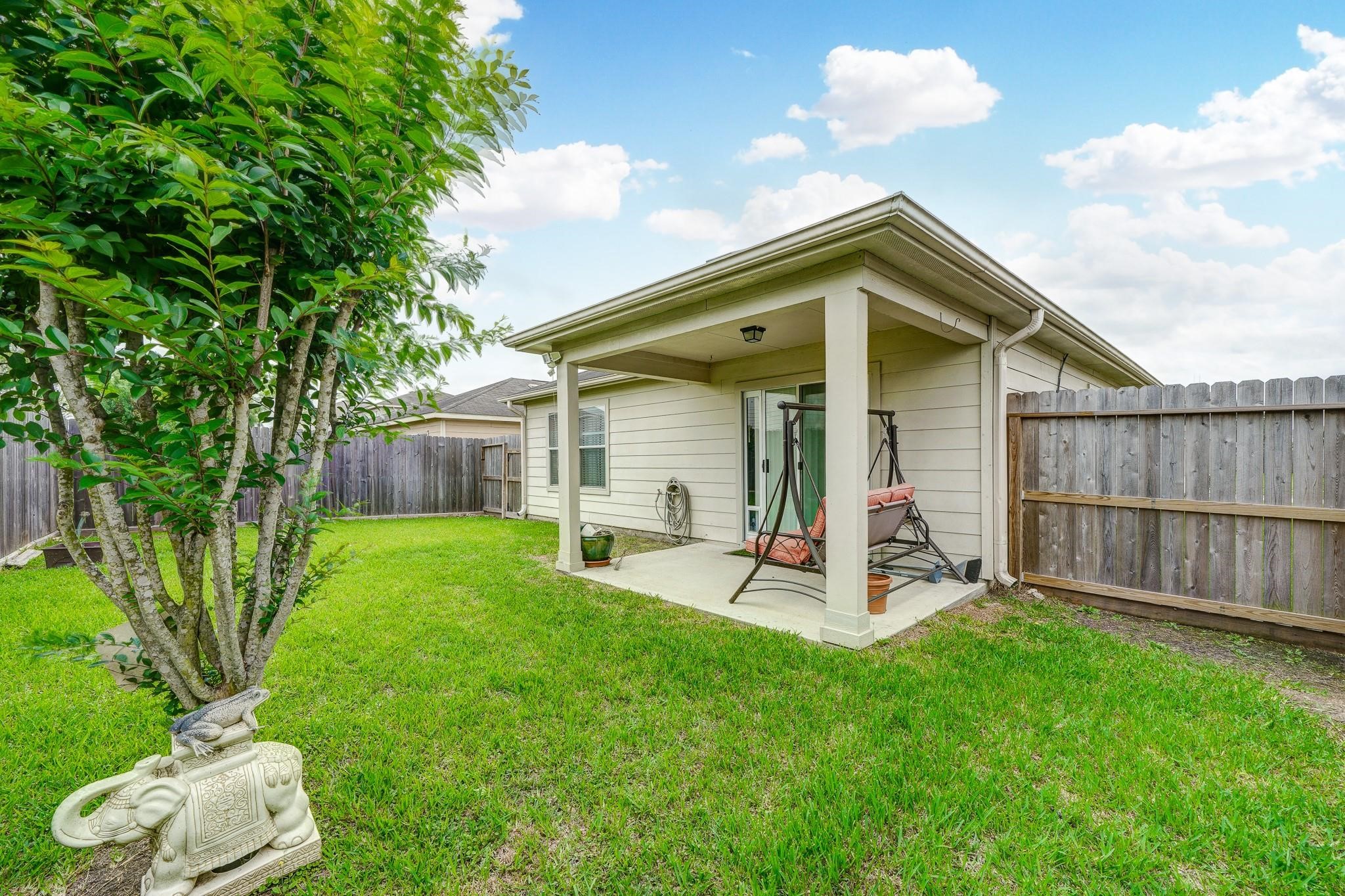 1934 Robcrest Way Missouri City, TX 77489 - Photo 19 of 24 a view of a house with a yard and sitting area