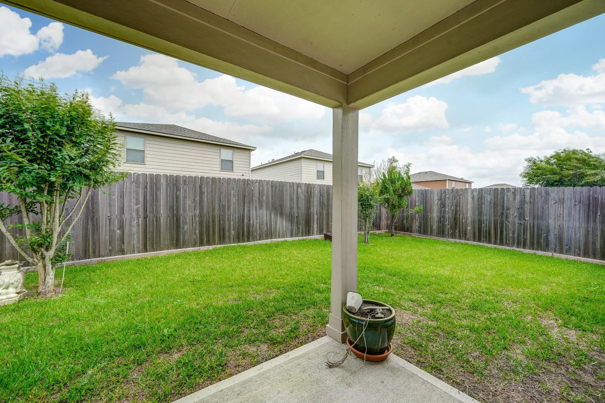 1934 Robcrest Way Missouri City, TX 77489 - Photo 20 of 24 a view of a back yard with a swing chair and table