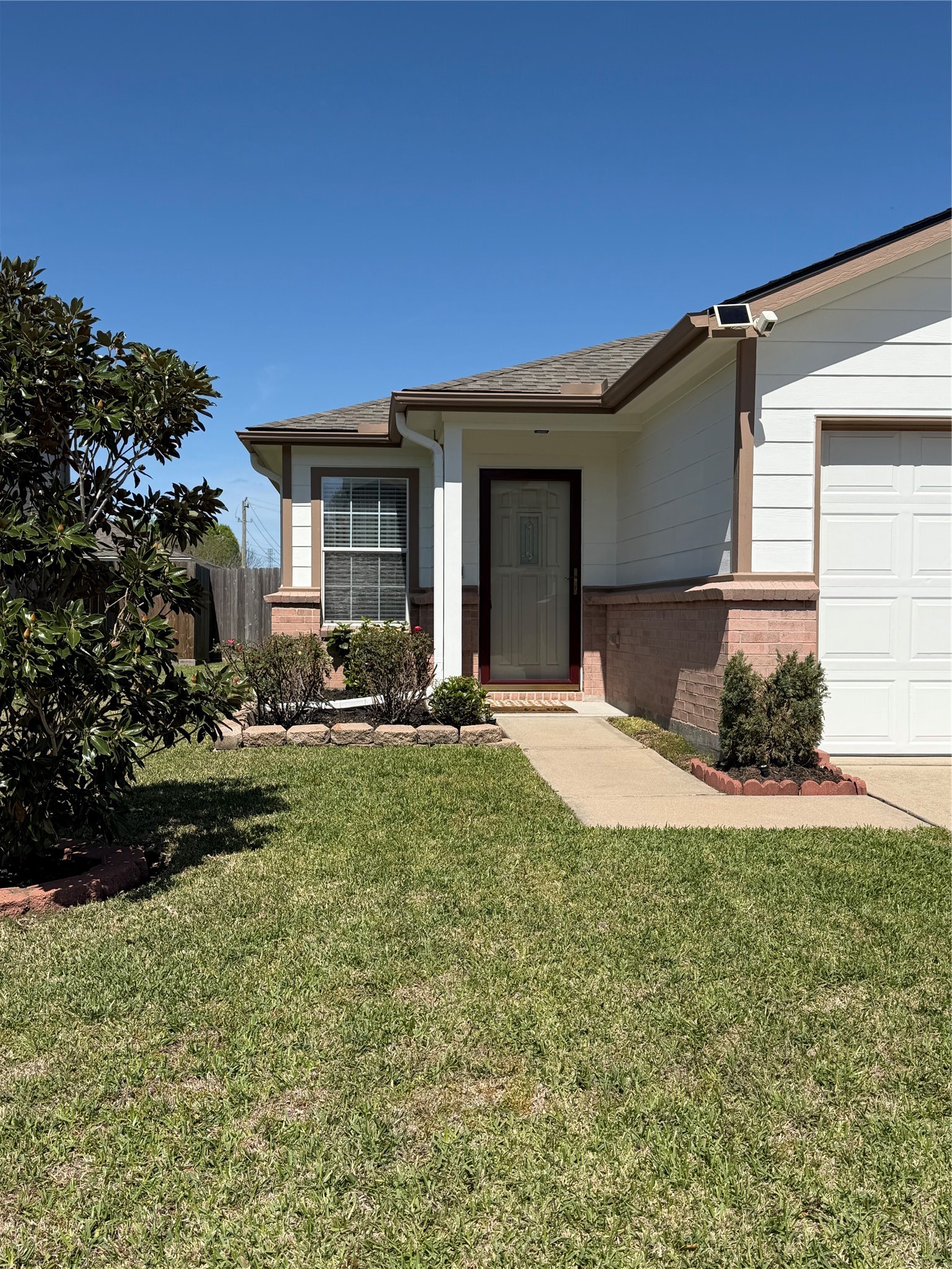 1934 Robcrest Way Missouri City, TX 77489 - Photo 2 of 24 a view of a house with backyard and garden