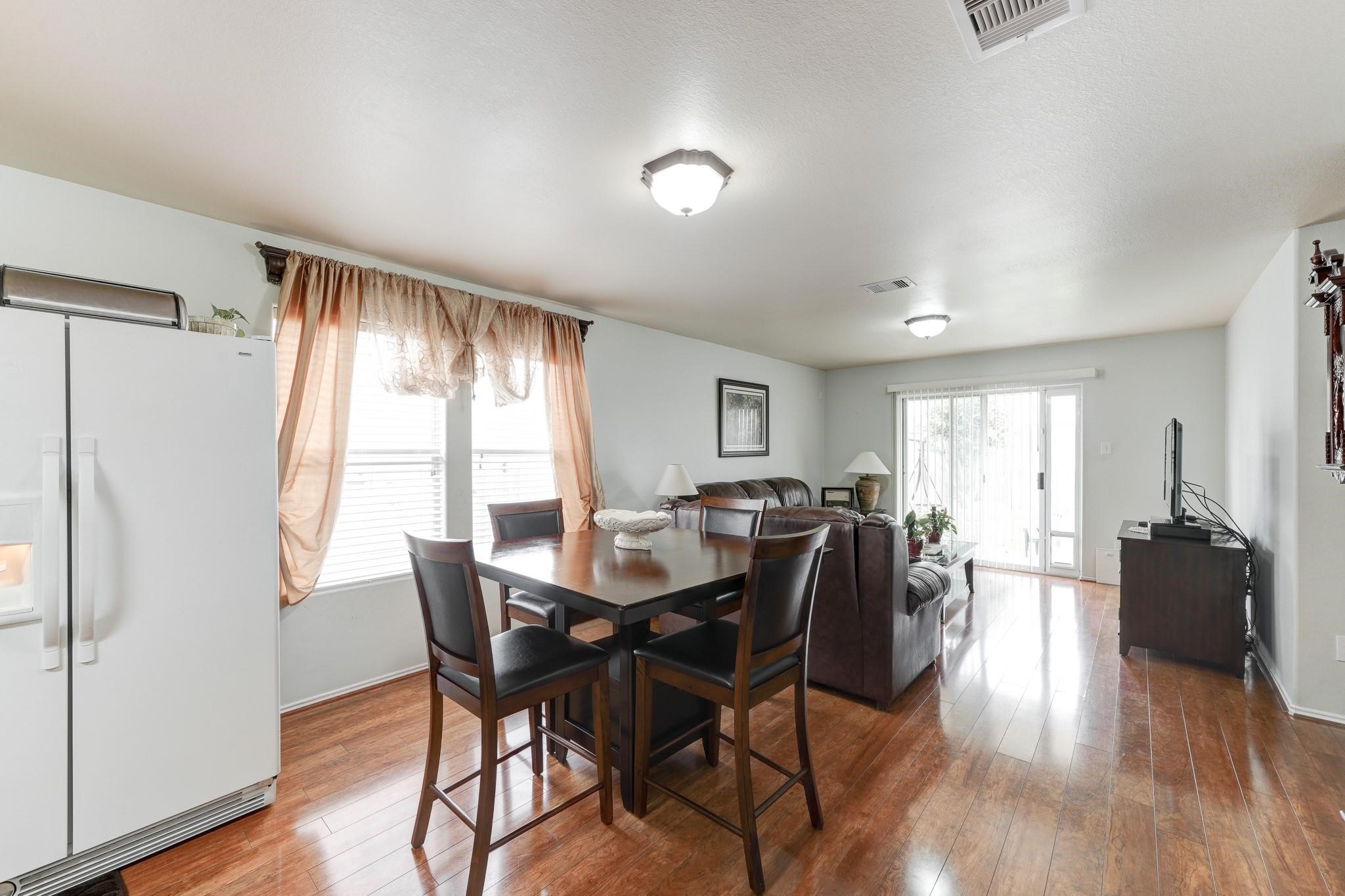 1934 Robcrest Way Missouri City, TX 77489 - Photo 8 of 24 a view of a dining room with furniture window and wooden floor