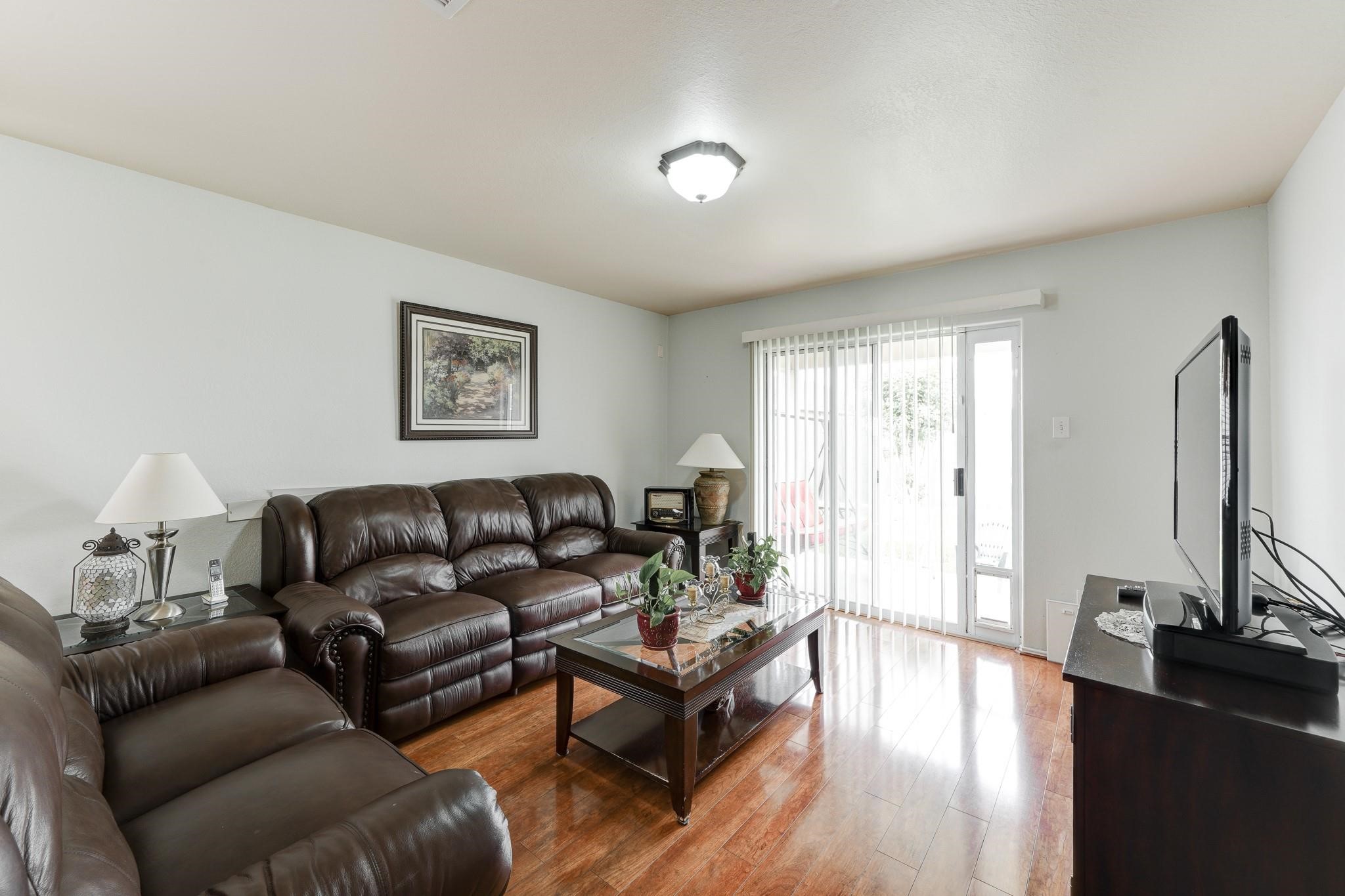 1934 Robcrest Way Missouri City, TX 77489 - Photo 9 of 24 a living room with furniture window and a flat screen tv