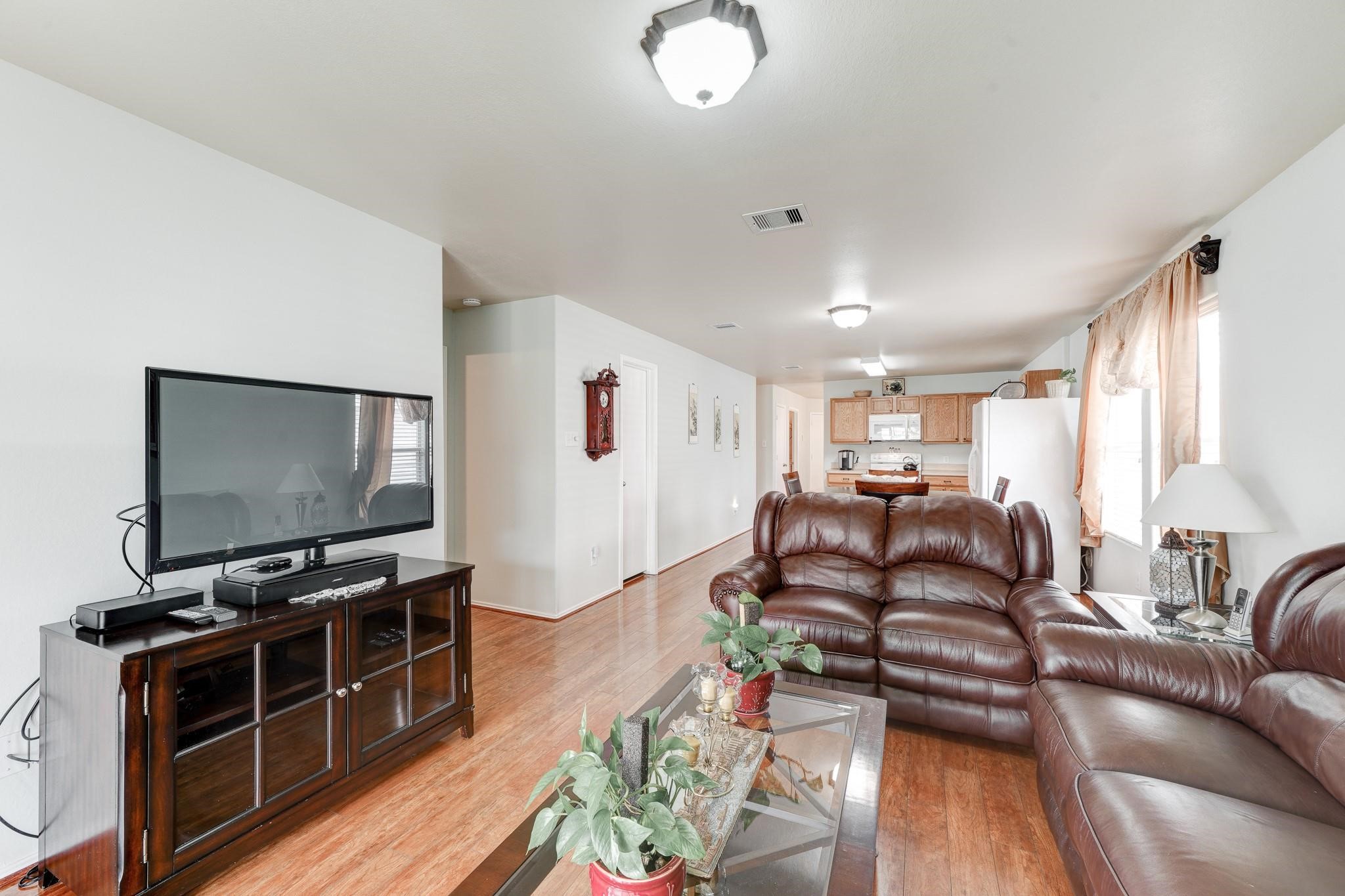 1934 Robcrest Way Missouri City, TX 77489 - Photo 10 of 24 a living room with furniture and a flat screen tv