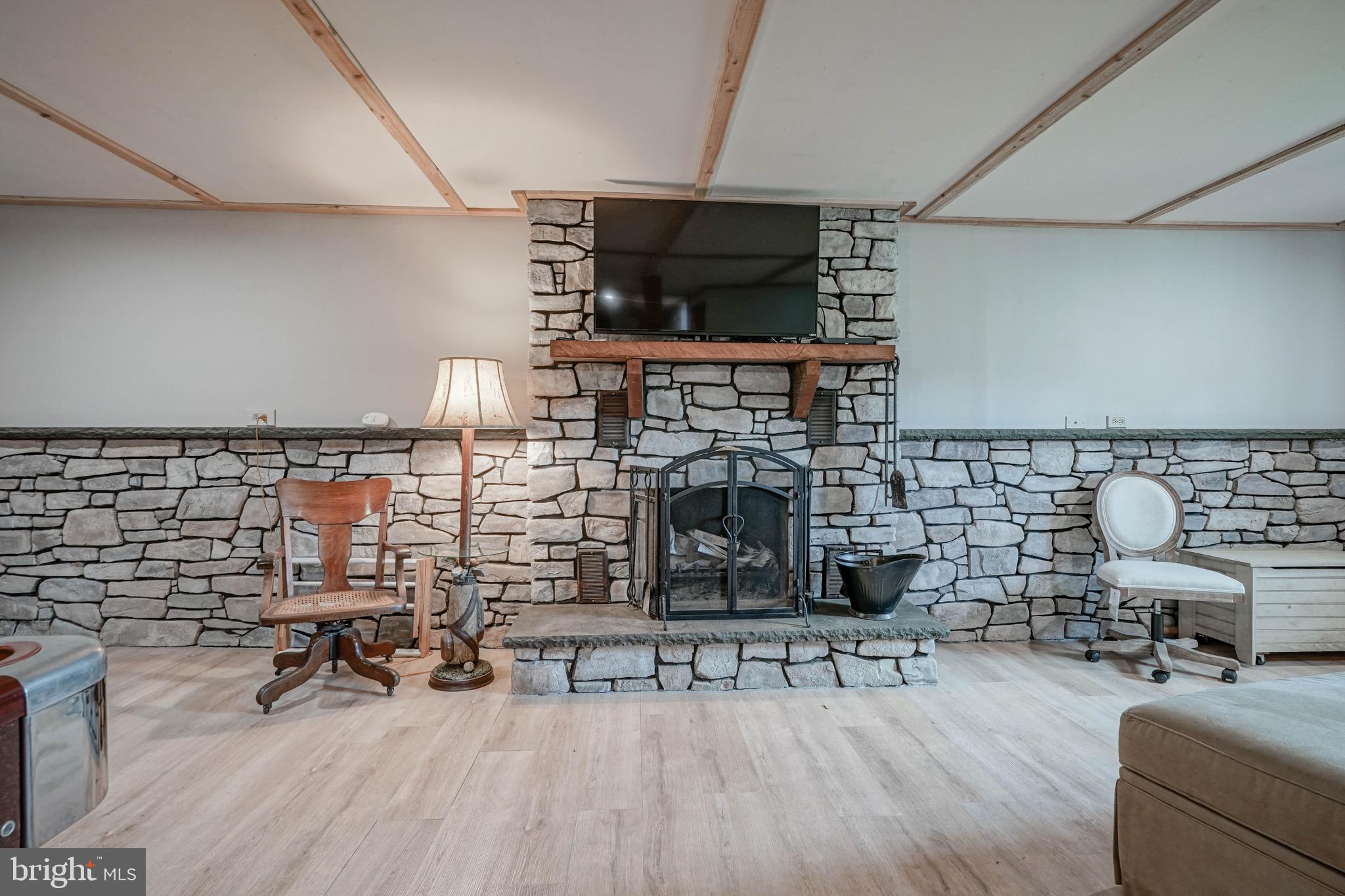 170 Fort Mott Road Pennsville, NJ 08070 - Photo 26 of 43 a living room with furniture and a fireplace
