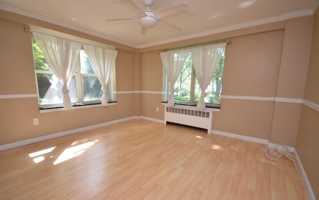 145 Pinckney Street, Unit 135 Boston, MA 02114 - Photo 2 of 7 a view of an empty room with a window