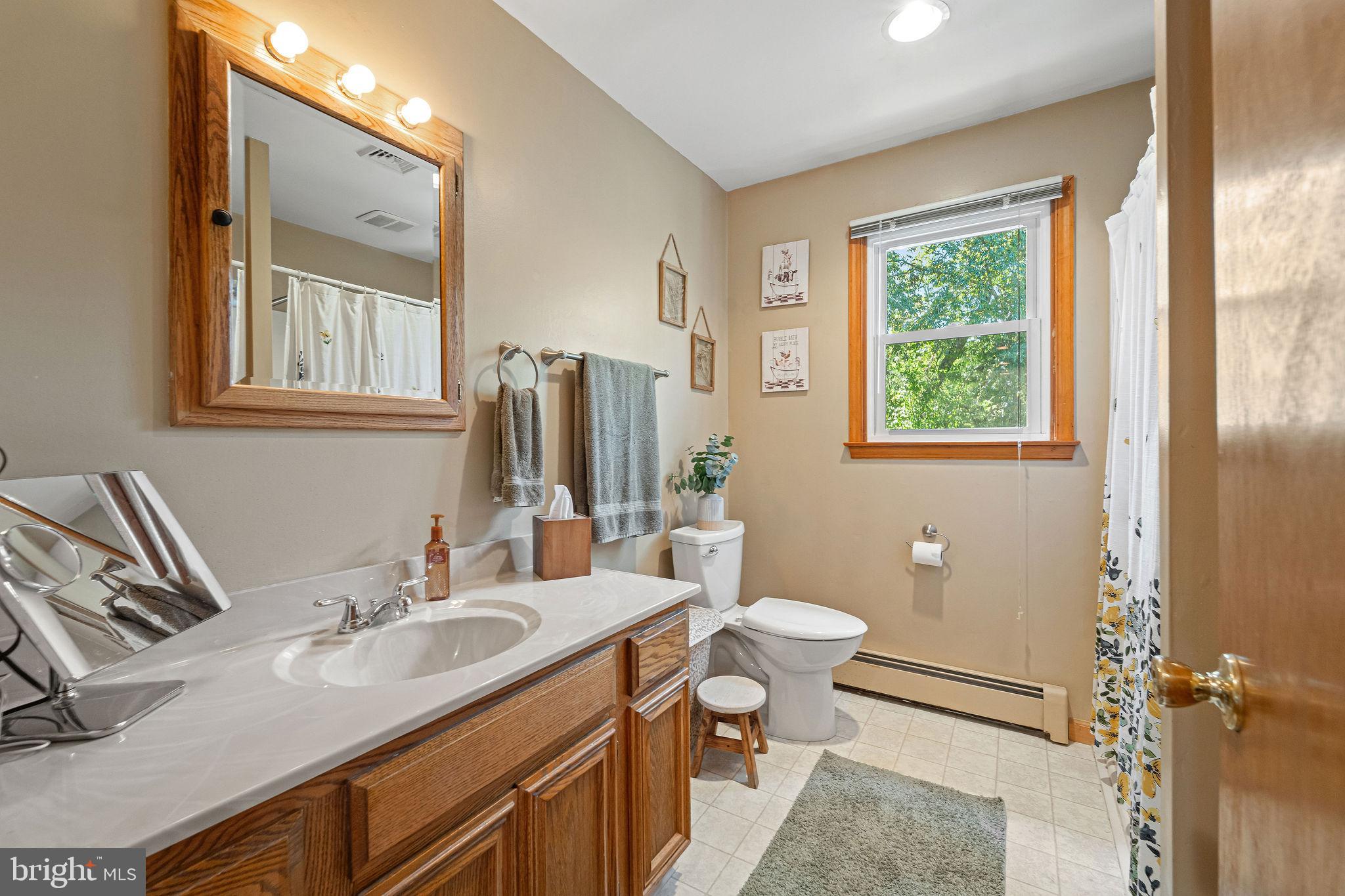16 Laurel Trail Bridgeton, NJ 08302 - Photo 13 of 31 a bathroom with a granite countertop sink toilet and a mirror